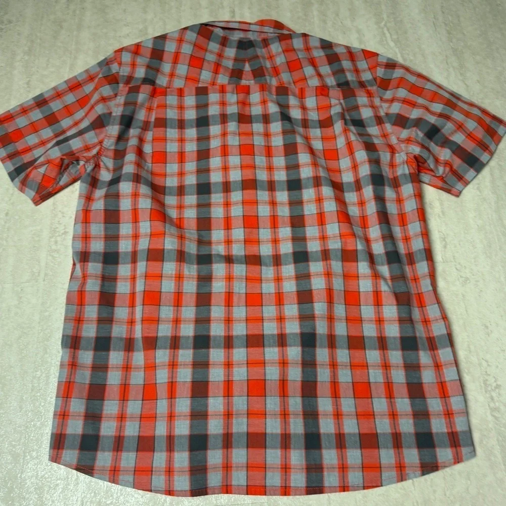 The North Face Orange and Gray Plaid Shirt snaps